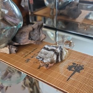 Gold-tone Winged Pendant Necklace with Dark Stone